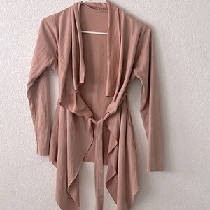 3/4 length sleeve over layer with belt.